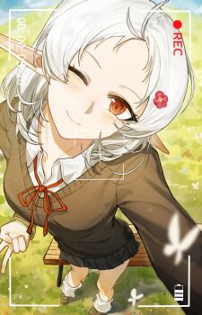 1girl absurdres ahoge bare_legs battery_indicator black_skirt blue_sky blush brown_shoes brown_sweater chinese_commentary cloud collared_shirt commentary dated fisheye forehead from_above full_body highres leg_warmers looking_at_viewer meadow medium_hair miniskirt mushoku_tensei neck_ribbon one_eye_closed outdoors parted_bangs pleated_skirt pointy_ears recording red_eyes red_ribbon ribbon selfie shirt shoes signature skirt sky smile solo standing sweater sylphiette_(mushoku_tensei) timestamp user_interface v white_hair white_leg_warmers white_shirt yisjhui