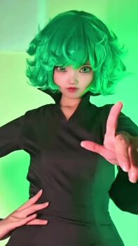 1girl animated black_hair breasts cosplay crossed_arms green_eyes green_hair green_screen hands_on_own_hips highres indoors looking_at_viewer music neneko0814 no_panties one-punch_man real_life sound tatsumaki tatsumaki_(cosplay) thick_thighs thighs video