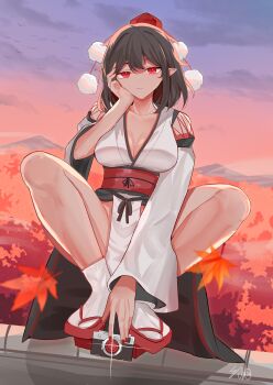 1girl autumn autumn_leaves black_hair breasts camera cleavage collarbone commentary dusk expressionless forest geta hat highres holding holding_camera leaf looking_at_viewer medium_hair nail_polish nature obi outdoors paraselene pelvic_curtain pom_pom_(clothes) red_eyes red_hat red_nails red_sash sash shameimaru_aya signature sitting socks solo squatting tabi tengu tengu-geta tokin_hat touhou white_socks