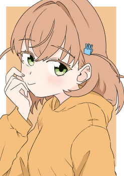 1girl absurdres blush border closed_mouth crossed_bangs green_eyes hair_ornament highres hinoshita_kaho hood hood_down hoodie kanzaki_gou link!_like!_love_live! long_sleeves looking_at_viewer love_live! orange_background orange_hair orange_hoodie outside_border rabbit_hair_ornament seeno_de!_hasu_no_sora! simple_background smile solo two_side_up white_border