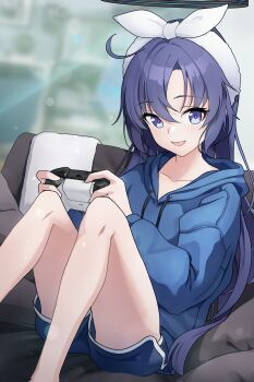 1girl absurdres alternate_costume alternate_hairstyle blue_archive blue_eyes blue_hair blue_hoodie blue_shorts blurry blurry_background bokeh commentary_request controller depth_of_field dolphin_shorts game_controller highres holding holding_controller holding_game_controller hood hood_down hoodie indoors knees_up long_sleeves looking_at_viewer plumbum puffy_long_sleeves puffy_sleeves short_shorts shorts sitting solo thighs yuuka_(blue_archive)