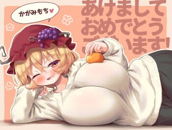 1girl adversarial_noise akeome aki_minoriko arinu black_skirt blonde_hair blush breasts commentary_request cowboy_shot food fruit hair_ornament happy_new_year hat holding holding_food holding_fruit holding_orange huge_breasts kagami_mochi long_sleeves looking_at_viewer lying mob_cap new_year on_side one_eye_closed open_mouth orange_(fruit) red_eyes short_hair skirt smile solo speech_bubble sweater text_background touhou