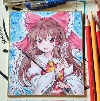 1girl art_tools_in_frame ascot bare_shoulders between_fingers blush bow brown_hair colored_pencil_(medium) commentary_request corrupted_twitter_file detached_sleeves frilled_bow frilled_hair_tubes frilled_shirt_collar frills gohei hair_between_eyes hair_bow hair_tubes hakurei_reimu hatching_(texture) highres holding holding_gohei kaoling korean_commentary linear_hatching long_hair long_sleeves looking_at_viewer ofuda open_mouth photo_(medium) red_bow red_eyes red_shirt ribbon-trimmed_sleeves ribbon_trim shide shikishi shirt sidelocks sleeve_bow sleeveless sleeveless_shirt smile solo sparkle touhou traditional_media upper_body white_sleeves wide_sleeves yellow_ascot