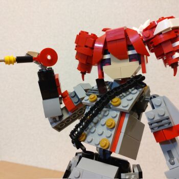 Rule 34 | 1girl, buttons, choroli (chorolin), double-breasted, drill hair, grey jacket, grey skirt, hair between eyes, hand up, highres, holding, jacket, kasane teto, kasane teto (sv), lego (medium), long sleeves, looking at viewer, red eyes, red hair, shoulder belt, skirt, solo, synthesizer v, twin drills, unconventional media, upper body, utau