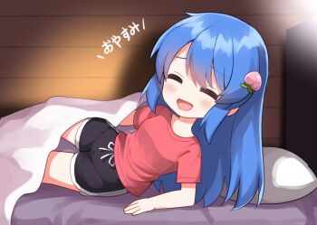 1girl :d bed black_shorts blanket blue_hair blush chibi chibi_only closed_eyes commentary_request drawstring facing_viewer food-themed_hair_ornament hair_ornament hinanawi_tenshi long_hair on_bed open_mouth peach_hair_ornament pillow red_shirt ruu_(tksymkw) shirt short_sleeves shorts smile solo t-shirt touhou translated wooden_wall