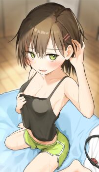 1girl armpits barefoot black_tank_top blush breasts brown_hair cleavage collarbone commentary_request dolphin_shorts green_eyes green_shorts hair_between_eyes hair_ornament hairclip hand_on_own_ear indoors on_blanket original piyomi short_hair shorts sideboob sitting sweat tank_top wariza