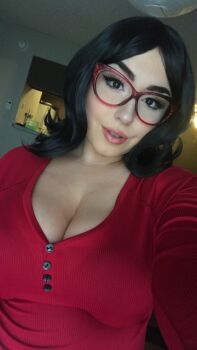 1girl 2018 black_hair bob's_burgers breasts brown_eyes buttons cleavage cosplay cosplay_photo eyelashes female_focus glasses kitchen large_breasts linda_belcher linda_belcher_(cosplay) lips looking_at_viewer makeup photo_(medium) pink_lips png_conversion red-framed_eyewear red_glasses red_shirt red_sweater shirt short_hair sideboob solo solo_focus source_request sweater teeth thejulietttemichele