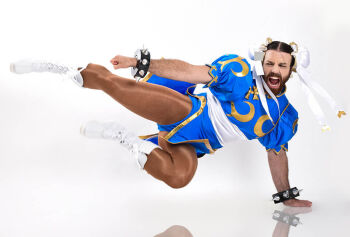 1boy blue_leotard capcom china_dress chinese_clothes chun-li chun-li_(cosplay) cosplay dress kicking ladybeard leotard photo_(medium) street_fighter street_fighter_ii_(series) what