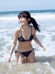 Rule 34 | 1girl, aida rikako, beach, bikini, looking to the side, outdoors, photo (medium), ponytail, smile, standing, swimsuit, voice actor