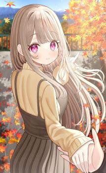 1boy 1girl autumn_leaves blonde_hair blue_sky blush breasts brown_dress closed_mouth dress highres holding_hands large_breasts leaf long_hair long_sleeves looking_at_viewer looking_back mizukoshi_(marumi) original outdoors pointing purple_eyes sky smile solo sweater
