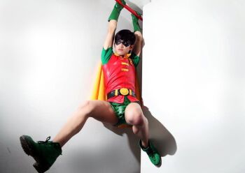 1boy batman_(series) belt cape cosplay dasutin dc_comics dick_grayson domino_mask eye_mask green_shoes male_focus mask photo_(medium) robin_(dc) shoes solo