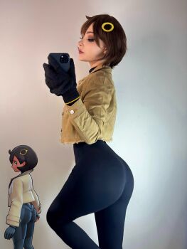 1girl ass black_gloves blush bodysuit brown_hair cosplay emma_(pokemon) emma_(pokemon)_(cosplay) gloves holding holding_phone jacket long_sleeves looking_at_viewer looking_back nintendo phone photo-referenced photo_(medium) pokemon pokemon_legends:_z-a purple_eyes selfie short_hair simple_background smile sneesnaw_(cosplayer)