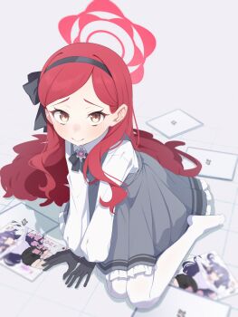 1girl absurdres black_gloves black_hairband black_ribbon blue_archive blush closed_mouth commentary dress frilled_dress frills gloves grey_dress hairband halo highres long_hair long_sleeves looking_at_viewer manga_(object) no_shoes on_floor pantyhose red_hair ribbon shirt sitting smile solo sweat takane_(blue_archive) take_mawile white_pantyhose white_shirt yuuka_(blue_archive)
