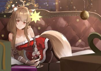 1girl absurdres animal_ear_fluff animal_ears araca_ra arm_support bare_shoulders blurry blurry_background blush breasts bridal_gauntlets brown_hair brown_pantyhose christmas_present christmas_tree cleavage closed_mouth collarbone couch cup dress drinking_glass eyelashes full_body fur_trim gift highres holding holo indoors long_hair lying medium_breasts on_couch on_side pantyhose red_dress red_eyes sidelocks smile solo spice_and_wolf strapless strapless_dress tail wine_glass wolf_ears wolf_girl wolf_tail