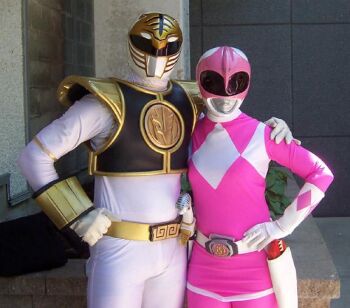 1boy 1girl cosplay gosei_sentai_dairanger kiba_ranger kyoryu_sentai_zyuranger looking_at_viewer mighty_morphin_pink_ranger mighty_morphin_white_ranger photo_(medium) power_rangers ptera_ranger super_sentai tokusatsu