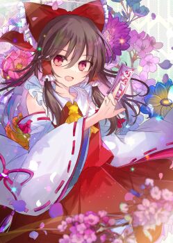 1girl ascot between_fingers blue_flower blurry bow brown_hair cherry_blossoms commentary_request depth_of_field detached_sleeves falling_petals flower flower_request frilled_bow frilled_hair_tubes frills hair_bow hair_tubes hakurei_reimu highres holding kazu_(muchuukai) long_hair ofuda ofuda_between_fingers open_mouth petals pink_flower pink_petals purple_flower red_bow red_eyes red_skirt ribbon-trimmed_sleeves ribbon_trim skirt skirt_set smile solo touhou yellow_ascot yellow_flower