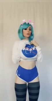 Rule 34 | 1girl, animated, animated gif, aqua hair, blue hair, bouncing breasts, breasts, cosplay, cowboy shot, earth-chan, earth-chan (cosplay), female focus, gym shorts, heart, jenna lynn meowri, large breasts, midriff, nasa, navel, photo (medium), short hair, shorts, solo, striped clothes, striped thighhighs, swept bangs, thighhighs, v