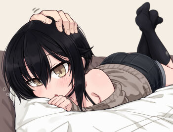 1boy 1girl bare_shoulders black_hair black_shorts black_socks blurry blush brown_eyes brown_sweater commentary_request denim denim_shorts depth_of_field hair_between_eyes headpat indoors kneehighs legs_up long_sleeves looking_at_viewer lying no_shoes null_(nyanpyoun) off_shoulder on_stomach open_mouth original short_hair shorts sleeves_past_wrists socks sweater
