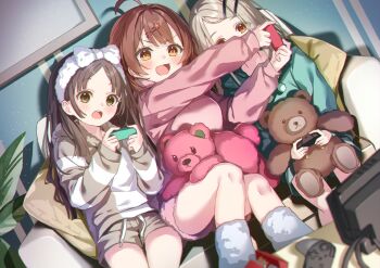3girls ahoge blonde_hair blush brown_eyes brown_hair commentary_request controller couch gakuen_idolmaster game_controller hair_ornament hairclip hanami_ume highres holding holding_controller holding_game_controller idolmaster indoors joy-con kuramoto_beta-carotene kuramoto_china long_hair long_sleeves looking_at_viewer multiple_girls nintendo_switch on_couch open_mouth orange_eyes parted_bangs playing_games shinosawa_hiro sitting smile stuffed_animal stuffed_toy teddy_bear