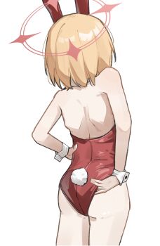 1girl adjusting_clothes animal_ears ass back bare_shoulders blonde_hair blue_archive cowboy_shot fake_animal_ears fake_tail from_behind halo hand_on_own_hip highres leotard loli median_furrow momoi_(blue_archive) pink_halo playboy_bunny puntikimaa rabbit_ears rabbit_tail red_leotard short_hair shoulder_blades simple_background solo strapless strapless_leotard tail white_background white_wrist_cuffs wrist_cuffs