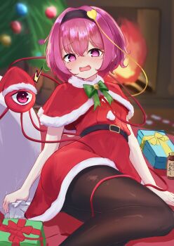 1girl @_@ absurdres alternate_costume belt black_belt black_hairband blush box brown_pantyhose capelet christmas christmas_tree commentary_request dress eyeball fur-trimmed_capelet fur_trim gift gift_box hairband highres holding holding_sack komeiji_satori looking_at_viewer open_mouth pantyhose pico_kimuchi pink_eyes pink_hair red_capelet red_dress sack santa_costume santa_dress solo textless_version third_eye touhou