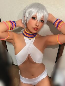 1girl arm_behind_head armpits bare_shoulders bikini bracelet breasts capcom cosplay cosplay_photo elena_(street_fighter) elena_(street_fighter)_(cosplay) female_focus hair_between_eyes highres jewelry looking_at_viewer navel parted_lips photo_(medium) real_life short_hair solo street_fighter street_fighter_6 swimsuit tan teeth ukaru1207 white_bikini white_hair