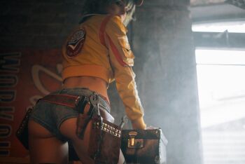 1girl ass belt bikini bikini_under_clothes blonde_hair breasts cidney_aurum cidney_aurum_(cosplay) cosplay denim denim_shorts final_fantasy final_fantasy_xv green_eyes hat jacket looking_at_viewer photo_(medium) shirogane-sama short_shorts shorts swimsuit tool_belt toolbox tools