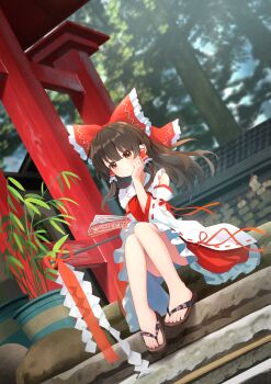 1girl absurdres bow brown_eyes brown_hair chinese_commentary commentary_request detached_sleeves frilled_bow frilled_hair_tubes frilled_skirt frills gohei hair_bow hair_tubes hakurei_reimu highres long_hair ofuda on_stairs outdoors red_bow red_skirt ribbon-trimmed_sleeves ribbon_trim sandals sitting skirt skirt_set solo toes torii touhou tree wrainman