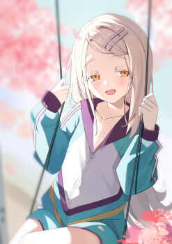 1girl absurdres blonde_hair blurry blurry_background blush chun_jiang collarbone colored_eyelashes flipped_hair gakuen_idolmaster green_shorts highres idolmaster jacket long_hair on_swing orange_eyes outdoors shinosawa_hiro shorts sitting smile solo swing track_jacket very_long_hair