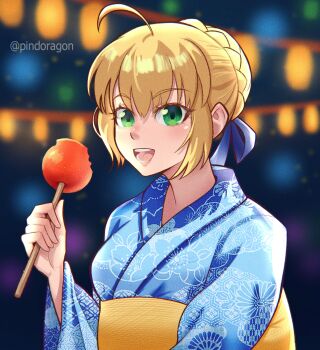 1girl absurdres artoria_pendragon_(fate) blonde_hair blue_ribbon braid braided_bun candy_apple commentary eating fate/grand_order fate/stay_night fate_(series) food green_eyes hair_between_eyes hair_bun hair_ribbon happy highres japanese_clothes kimono looking_at_viewer night pindoragon ribbon saber_(fate) sidelocks smile solo summer_festival yukata