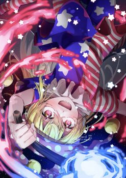 1girl american_flag american_flag_legwear american_flag_print american_flag_shirt blonde_hair clownpiece commentary_request fairy fire flag_print hat highres holding holding_torch long_hair looking_at_viewer mizuni_takenoko parted_lips print_shirt red_eyes shirt short_sleeves smile solo star-shaped_pupils star_(symbol) symbol-shaped_pupils torch touhou upside-down