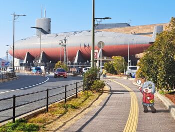 ! 1girl black_pantyhose blue_eyes blue_sky car cloud commentary day grey_hair grey_skirt hama!_(3toshinhmkz) hamakaze_(kancolle) highres js_akishio_(ss-579) kantai_collection kure_(city) motor_vehicle museum outdoors pantyhose photo_background pleated_skirt pointing railing short_hair skirt sky solo spoken_exclamation_mark submarine watercraft