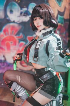 1girl 2024 a_erukun absurdres animal_ears arms_up black_gloves black_hair black_necktie black_shorts blurry blurry_background boots brand_name_imitation breasts commentary contrapposto cosplay cosplay_photo crop_top depth_of_field feet feet_out_of_frame female_focus fingerless_gloves fingernails from_side full_body fur-trimmed_jacket fur_trim garter_straps gloves graffiti green_eyes grey_boots grey_jacket grey_thighhighs highres indoors jacket jane_doe_(zenless_zone_zero) jane_doe_(zenless_zone_zero)_(cosplay) kneeling knees_up lace_trim large_breasts light_smile long_fingernails long_hair long_sleeves looking_at_viewer midriff mouse_ears mouse_girl mouse_tail multicolored_necktie multiple_views necktie pants pantyhose photo_(medium) real_life red_lips red_necktie selfie shadow sharp_fingernails sharp_tail shorts skindentation soles tail thick_thighs thighhighs thighs torn_clothes torn_thighhighs unworn_pants wide_hips zenless_zone_zero