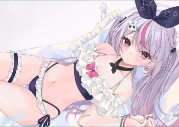 1girl bikini blush bow closed_mouth commentary_request earrings frilled_bikini frills hair_bow hair_ornament heart heart_earrings jewelry looking_at_viewer lying moizumi_shipon multicolored_hair navel pillow pink_eyes pink_hair purple_hair signature solo streaked_hair swimsuit thick_eyebrows thigh_strap tosaki_mimi tosaki_mimi_(summer_c102) two-tone_hair virtual_youtuber vspo!