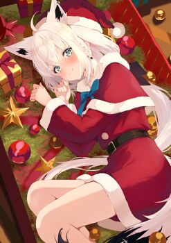 1girl absurdres ahoge alternate_costume animal_ear_piercing animal_ears aqua_eyes belt black_belt black_ribbon box braid capelet closed_mouth commentary_request crossed_bangs double-parted_bangs dress extra_ears fox_ears fox_girl fox_tail fur-trimmed_capelet fur-trimmed_dress fur-trimmed_headwear fur_trim gift gift_box hair_between_eyes hair_ribbon hat highres hololive in_box in_container light_blush long_hair long_sleeves looking_at_viewer low_ponytail lying natsuki_(natsu_1936) on_side pentagram pom_pom_(clothes) ponytail red_capelet red_dress red_hat ribbon santa_costume santa_dress santa_hat shirakami_fubuki short_dress side_braid single_braid smile solo tail very_long_hair virtual_youtuber white_hair