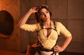 1girl boots breasts brown_boots cleavage cosplay cosplay_photo elizabeth_rage female_focus goggles goggles_on_head hange_zoe hange_zoe_(cosplay) highres large_breasts looking_at_viewer pants paradis_military_uniform photo_(medium) real_life shingeki_no_kyojin shirt solo white_pants yellow_shirt