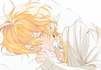 1boy aether_(genshin_impact) ahoge alternate_costume alternate_hairstyle blonde_hair blush che_0ng closed_mouth collared_shirt earrings genshin_impact hair_between_eyes highres jewelry long_hair long_sleeves looking_at_viewer lying male_focus on_bed on_side pillow shirt simple_background single_earring smile solo upper_body white_background white_shirt yellow_eyes