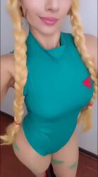 Rule 34 | 1girl, animated, blonde hair, blowing kiss, braid, breasts, cammy white, cammy white (cosplay), claubailarinita, cosplay, green eyes, hat, leotard, long hair, looking at viewer, one eye closed, real life, sound, street fighter, tagme, video, wink