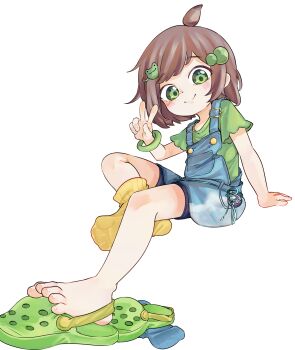 1girl barefoot blue_overalls brown_hair chaosexceed closed_mouth commentary crocs green_eyes green_shirt highres indie_virtual_youtuber lily_hopkins looking_at_viewer overalls paid_reward_available shirt short_sleeves simple_background sitting smile socks solo toes v virtual_youtuber white_background