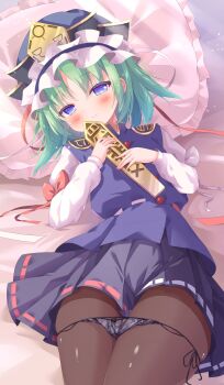 1girl absurdres bed_sheet black_panties black_skirt blue_eyes blue_vest blush commentary_request green_hair hat highres long_sleeves looking_at_viewer lying medium_hair ohitoriplayer on_back panties panties_around_thighs pantyhose pillow rod_of_remorse shiki_eiki shirt side-tie_panties single_sidelock skirt smile solo thighs touhou underwear vest white_shirt