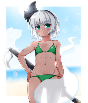 1girl alternate_costume beach bikini black_hairband blurry blurry_background blush border breasts commentary cowboy_shot flat_chest green_bikini green_eyes grey_hair groin hairband halterneck highres hitodama huyusilver konpaku_youmu konpaku_youmu_(ghost) looking_at_viewer navel outdoors see-through_silhouette short_hair small_breasts solo stomach string_bikini swimsuit sword sword_on_back symbol-only_commentary tan tanline touhou weapon weapon_on_back white_border