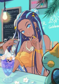 1girl alternate_costume bare_shoulders black_hair blue_eyes blue_eyeshadow blue_hair bracelet breasts chalkboard chewtle commentary_request corsola crop_top cropped_shirt dark-skinned_female dark_skin demekin2333 dessert earclip earrings eyelashes eyeshadow flower food food_on_hand gen_1_pokemon gen_2_pokemon gen_3_pokemon gen_8_pokemon goldeen hair_bun hands_up head_tilt highres hoop_earrings indoors jewelry light_bulb long_hair looking_at_viewer makeup medium_breasts milotic multicolored_hair nail_polish necklace nessa_(pokemon) nintendo off-shoulder_shirt off_shoulder orange_shirt parted_lips pokemon pokemon_(creature) pokemon_swsh ring shellder shirt single_hair_bun smile two-tone_hair white_flower