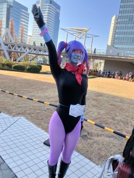 1girl arm_up belt black_leotard breasts city cosplay gradient_hair green_eyes highleg highleg_leotard highres japanese_(nationality) kamen_rider leotard lips long_hair looking_at_viewer multicolored_hair outdoors pantyhose photo_(medium) purple_hair shiny_clothes shocker_(kamen_rider) smile solo ssssensu standing toujima_tanzaburou_wa_kamen_rider_ni_naritai twintails yukarisu yukarisu_(cosplay)