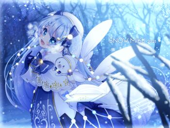 1girl 2021 :d absurdres beret blue_bow blue_eyes blue_gloves blue_hair blue_theme blurry blurry_background book bow braid capelet character_name christmas_lights commentary depth_of_field dress english_commentary gloves hair_between_eyes hat hatsune_miku highres musical_note open_book open_mouth pina710 rabbit_yukine smile solo twintails vocaloid white_capelet white_hat yuki_miku yuki_miku_(2021)