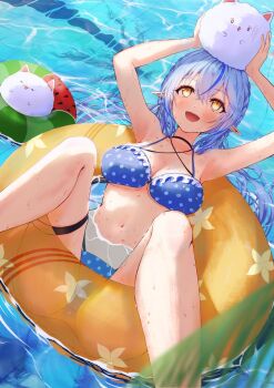 1girl absurdres arms_up bikini blue_bikini blue_hair blurry blurry_foreground breasts cleavage elf highres hololive large_breasts long_hair navel open_mouth palm_tree partially_submerged pointy_ears pool smile solo_focus spread_legs swim_ring swimsuit tree virtual_youtuber water yaki_no_yaki yellow_eyes yukihana_lamy yukimin_(yukihana_lamy)