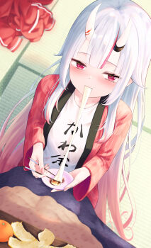 1girl absurdres eating food fruit hair_between_eyes hair_between_horns highres hololive horns indoors jacket japanese_clothes kimono kotatsu light_blush long_hair looking_at_viewer makushiro_081 mandarin_orange mochi mochi_trail multicolored_hair nakiri_ayame nakiri_ayame_(cutie_jersey) official_alternate_costume oni red_eyes red_hair red_jacket red_kimono shirt skin-covered_horns solo table virtual_youtuber white_hair white_shirt
