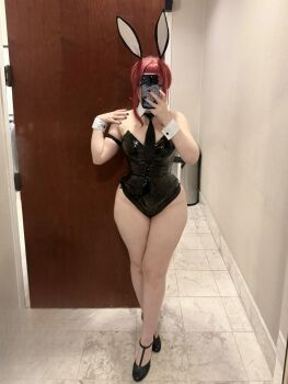 1girl bare_shoulders black_leotard chainsaw_man cosplay curvy detached_collar full_body highleg highleg_leotard highres holding holding_phone legs leotard long_hair long_legs makima_(chainsaw_man) makima_(chainsaw_man)_(cosplay) medium_hair phone photo_(medium) playboy_bunny rabbit_ears real_life red_hair sailorscholar_(cosplayer) selfie shiny_clothes solo strapless strapless_leotard thick_thighs thighs wide_hips