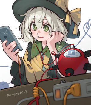 1girl :d bow cellphone charging_device collared_shirt commentary_request electrical_outlet frilled_shirt_collar frilled_sleeves frills green_eyes green_hair green_hat hair_between_eyes hat hat_bow head_rest heart heart_of_string highres holding holding_phone kanpa_(campagne_9) komeiji_koishi listening_to_music long_sleeves medium_hair mp3_player open_mouth phone power_strip shirt smartphone smile solo third_eye touhou twitter_username upper_body wide_sleeves yellow_bow yellow_shirt yin_yang yin_yang_print