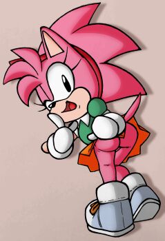 1girl amy_rose animal animal_ears ass black_eyes blue_shoes classic_amy_rose clothes_lift finger_to_mouth from_behind furry gloves green_shirt grey_background hairband hedgehog hedgehog_girl highres jupiter_orange leaning_forward loli looking_at_viewer looking_back no_panties one_eye_closed open_mouth orange_skirt pink_fur pink_hair puffy_sleeves sega shirt shoes short_hair short_sleeves skirt skirt_lift smile sneakers sonic_(series) spiked_hair standing tail white_gloves wink