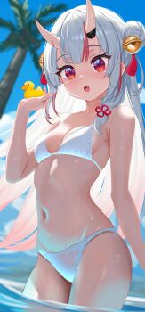 1girl absurdres bell bikini blue_sky blurry blurry_background breasts center-flap_bangs cleavage commentary day double_bun english_commentary fang gradient_hair hair_bell hair_between_horns hair_bun hair_ornament hand_up highres holding_rubber_duck hololive horns jingle_bell long_hair looking_at_viewer maverick_(mvk022) medium_breasts multicolored_hair nakiri_ayame navel oni open_mouth outdoors red_eyes red_hair rubber_duck skin-covered_horns sky solo standing streaked_hair swimsuit tassel tassel_hair_ornament teeth two_side_up upper_teeth_only virtual_youtuber wading wet white_bikini white_hair